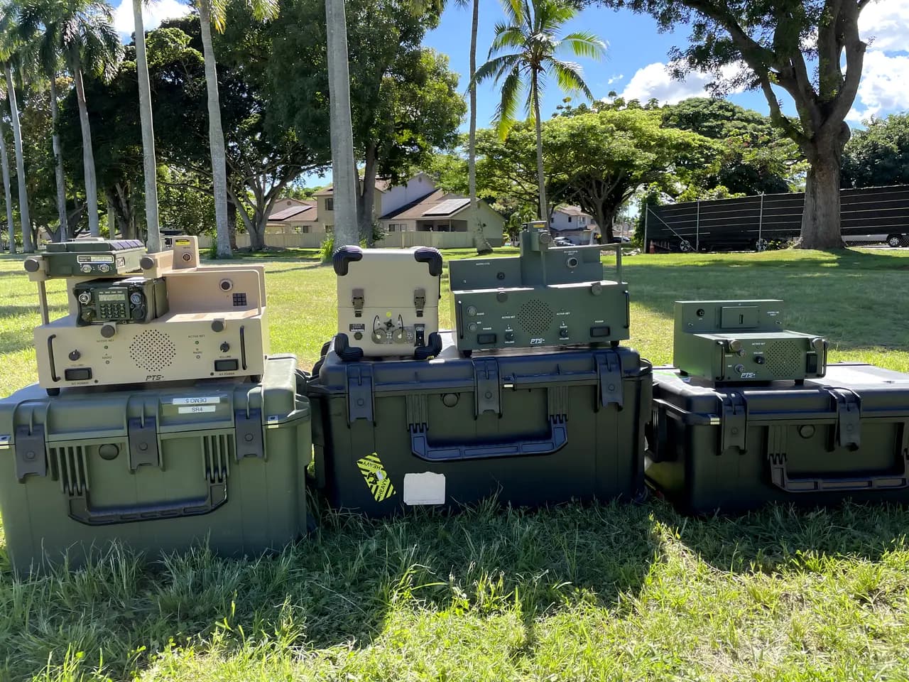 Three docking station kits staged on transit cases