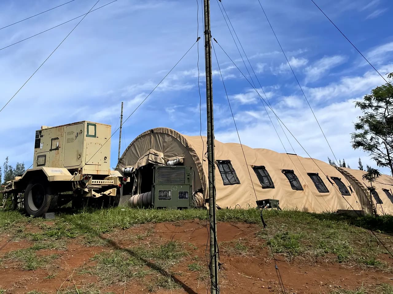 Antenna mast, environmental control unit, and shelter at a field command post