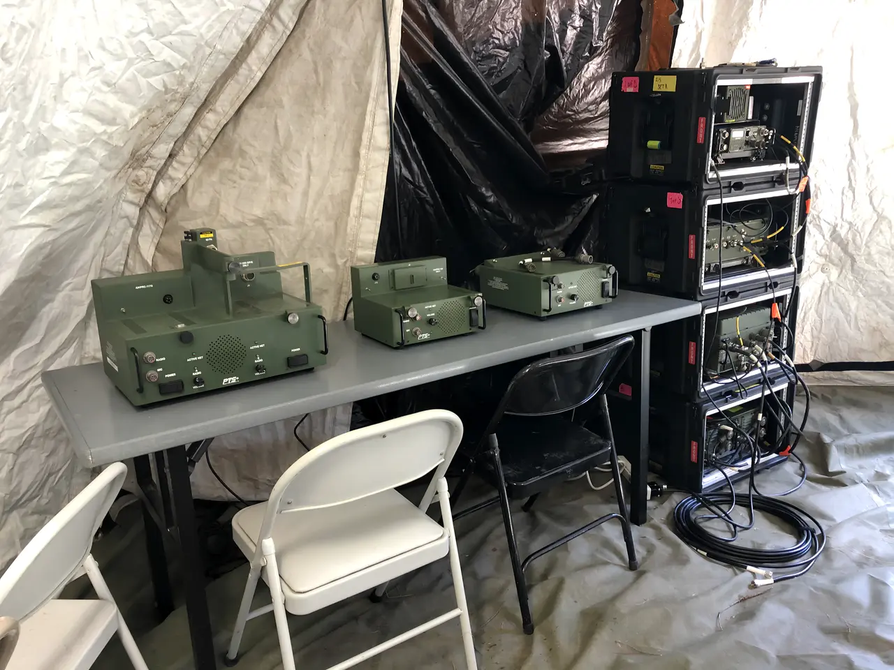 Docking stations and transit racks inside a field tent