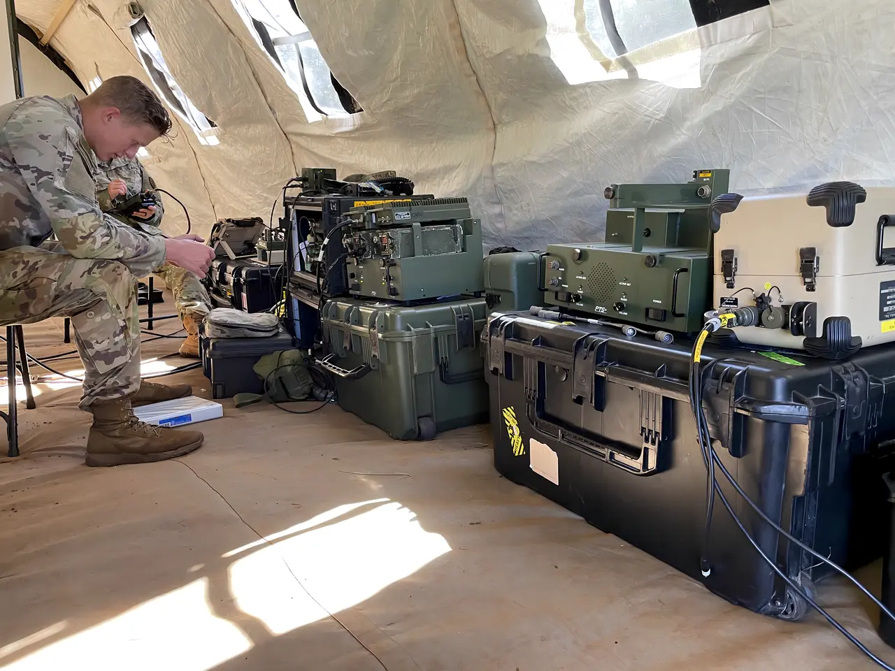 Communications equipment set up inside a field tent